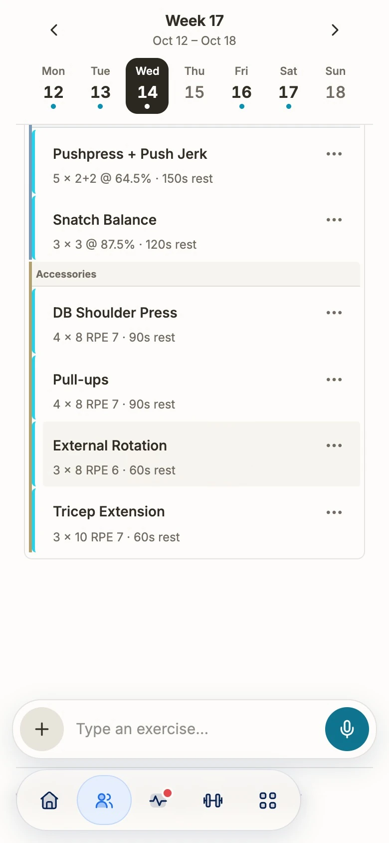 The week builder on a phone: week 17, Wednesday 14 October, with push press plus push jerk 5 × 2+2 at 64.5%, snatch balance 3 × 3 at 87.5% and four accessories with RPE targets, above a “Type an exercise…” bar with a microphone button