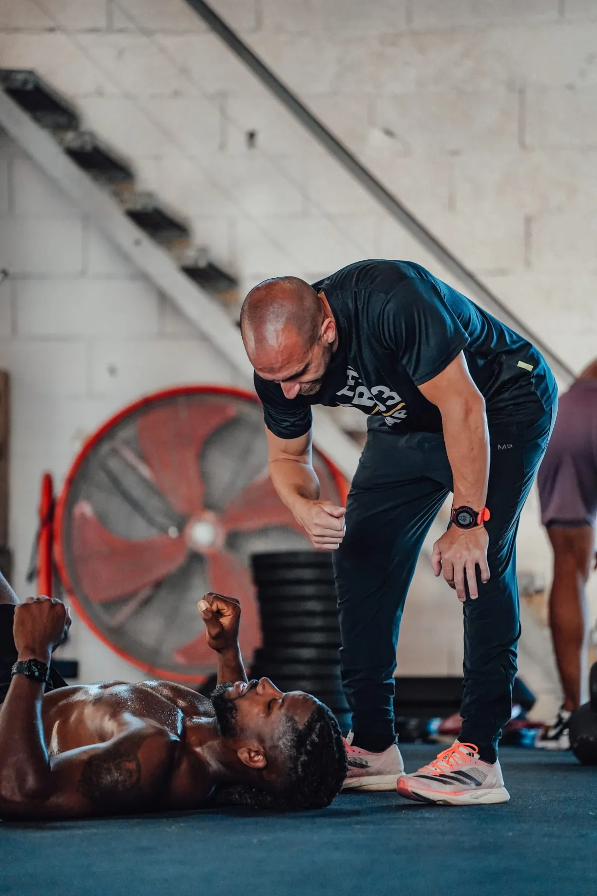 William Boirat coaching a client through a set